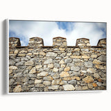 Framed canvas artwork depicting a stunning landscape with a castle, presented in a white frame. The image showcases vibrant colors and intricate details, ideal for home decor.