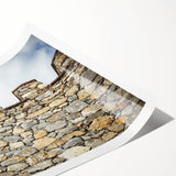 Stunning landscape canvas print featuring a majestic castle surrounded by lush greenery and mountains, rolled and ready for framing, enhances any decor style.