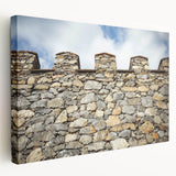 Stretched canvas artwork showcasing a picturesque landscape with a majestic castle set against a vibrant sunset, perfect for home decor and art enthusiasts.