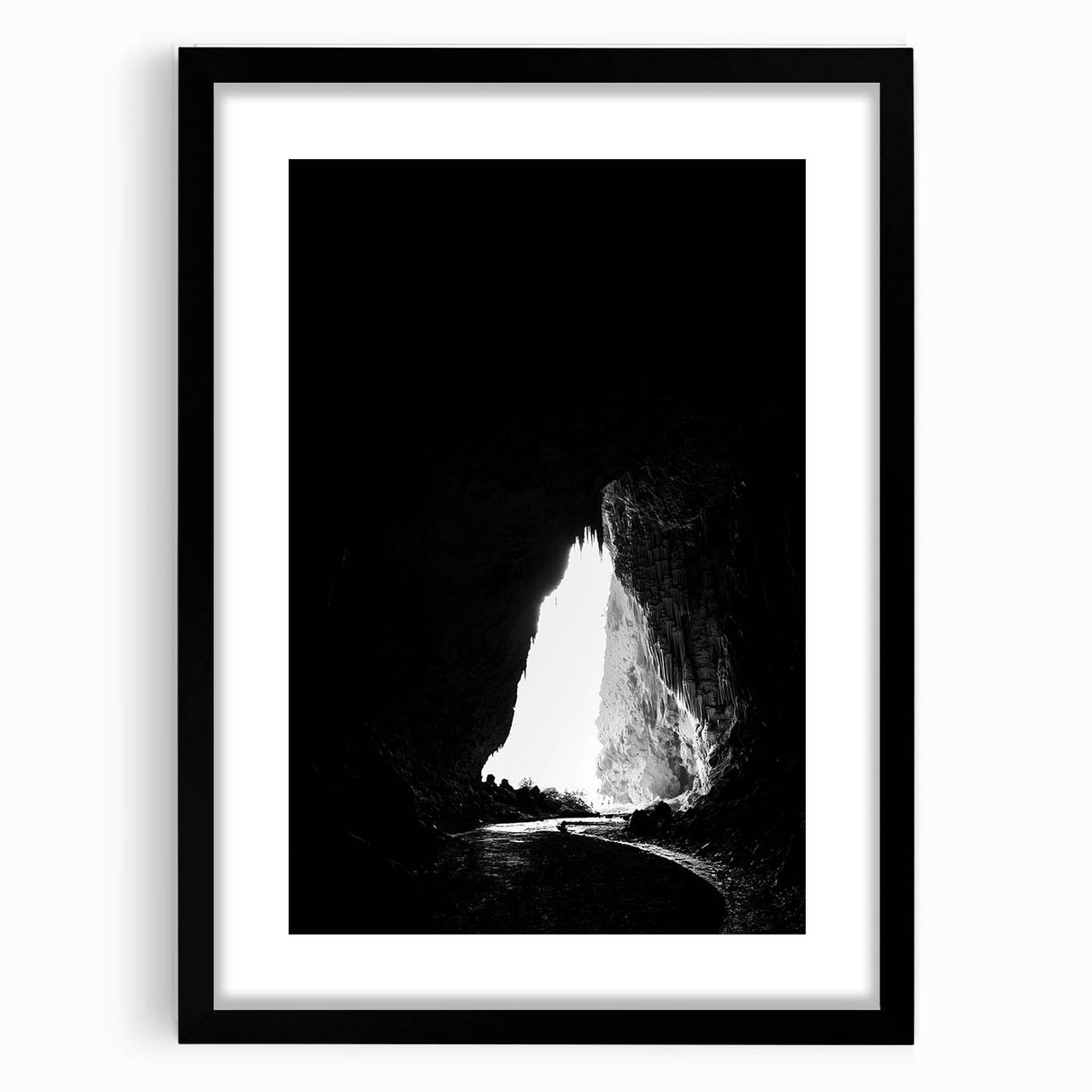 Framed landscape artwork featuring a serene cave scene with a black mat, designed to enhance home decor with its natural beauty and calming colors.