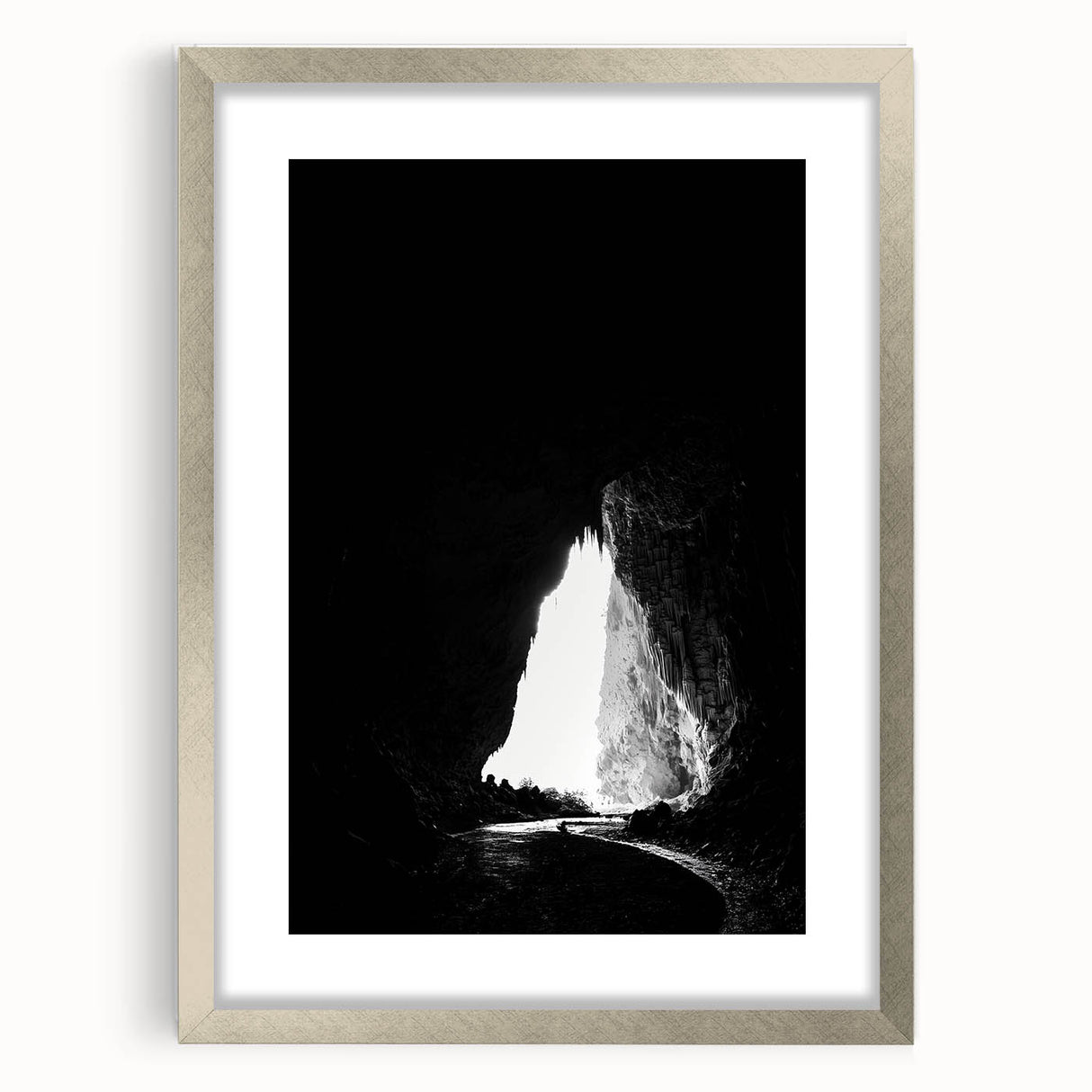 Framed landscape artwork depicting a serene cave scene with a silver mat and sleek frame, ideal for enhancing home decor with natural beauty and tranquility.
