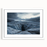 Framed landscape artwork depicting majestic cliffs under a clear blue sky, featuring a white mat border, ideal for home decor or office settings.