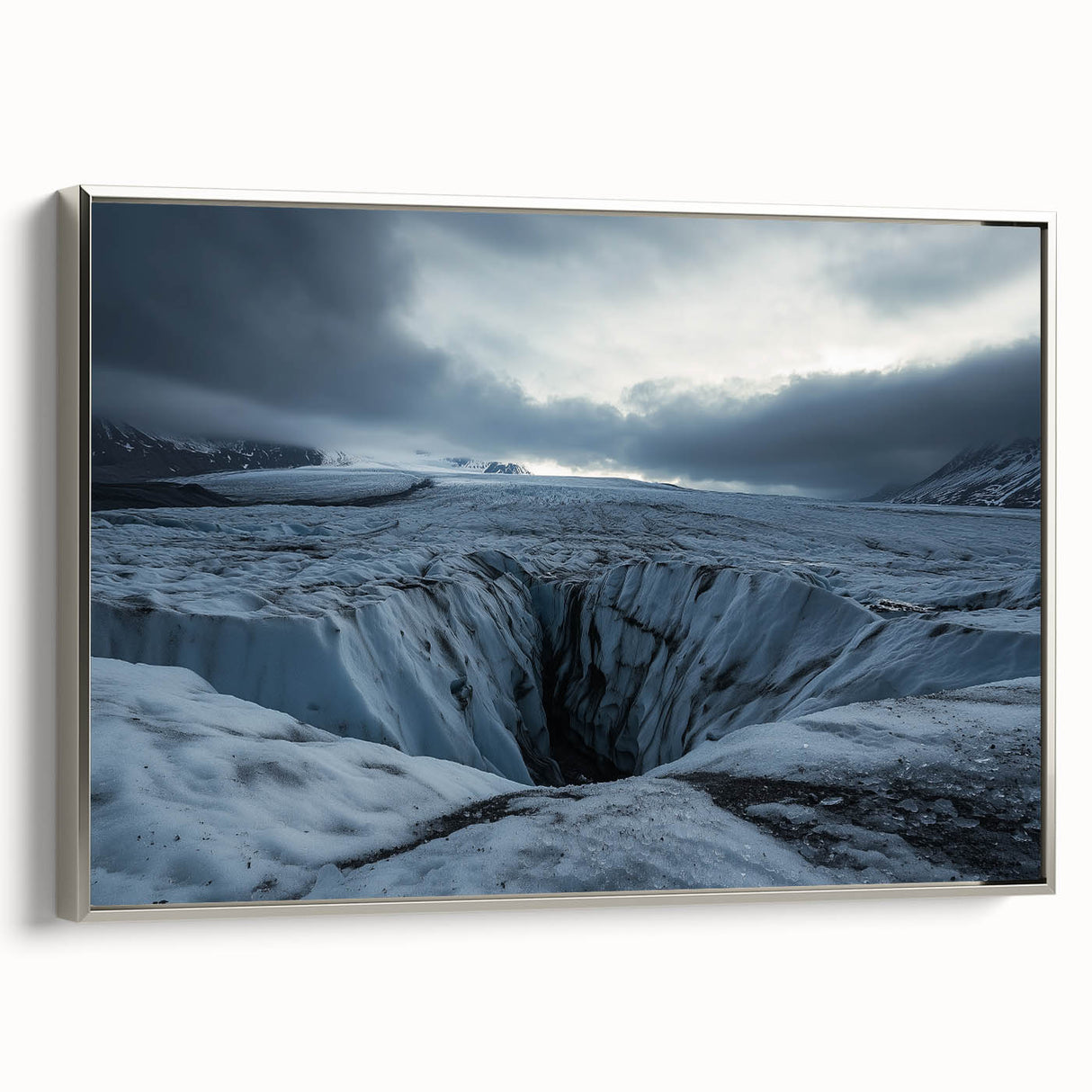 Framed canvas artwork depicting a stunning landscape of towering cliffs, highlighted by silver accents, ideal for enhancing modern home decor.