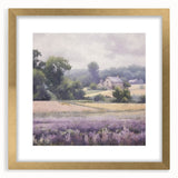 Framed landscape wall art depicting a serene countryside scene with lush greenery and a clear sky, featuring a gold mat for an elegant finish, perfect for home decor.