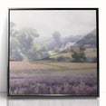 Framed acrylic wall art depicting a serene countryside landscape, featuring lush green fields and a clear blue sky, showcased in a sleek black frame.