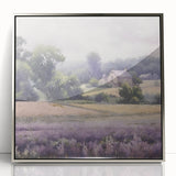Framed acrylic wall art showcasing a serene countryside landscape, featuring lush green fields and a vibrant blue sky, elegantly displayed in a silver frame.