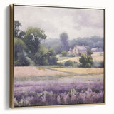 Framed landscape wall art depicting a serene countryside scene with vibrant green fields and a soft blue sky, accented with elegant silver and gold tones.
