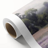 Landscape wall art on rolled canvas depicting a serene countryside scene with lush green fields and a vibrant blue sky, ideal for home decor.