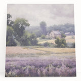 Landscape wall art featuring a serene countryside scene with lush green fields and a vibrant blue sky, printed on stretched canvas and leaning against a neutral background. Ideal for enhancing home decor with a touch of nature.