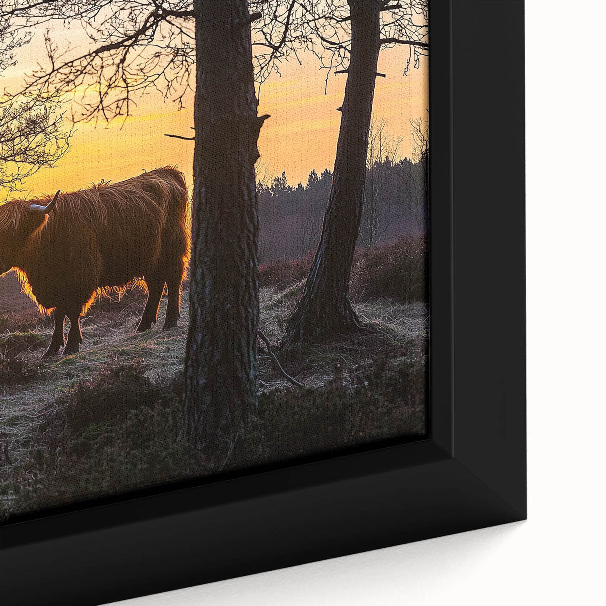 Close-up of a framed canvas depicting a serene countryside landscape with lush greenery, rolling hills, and a bright blue sky, perfect for home decor.