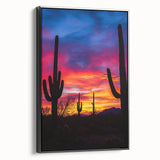 Framed canvas artwork depicting a stunning desert landscape with vivid colors and intricate details, showcased in a sleek black frame, perfect for modern decor.