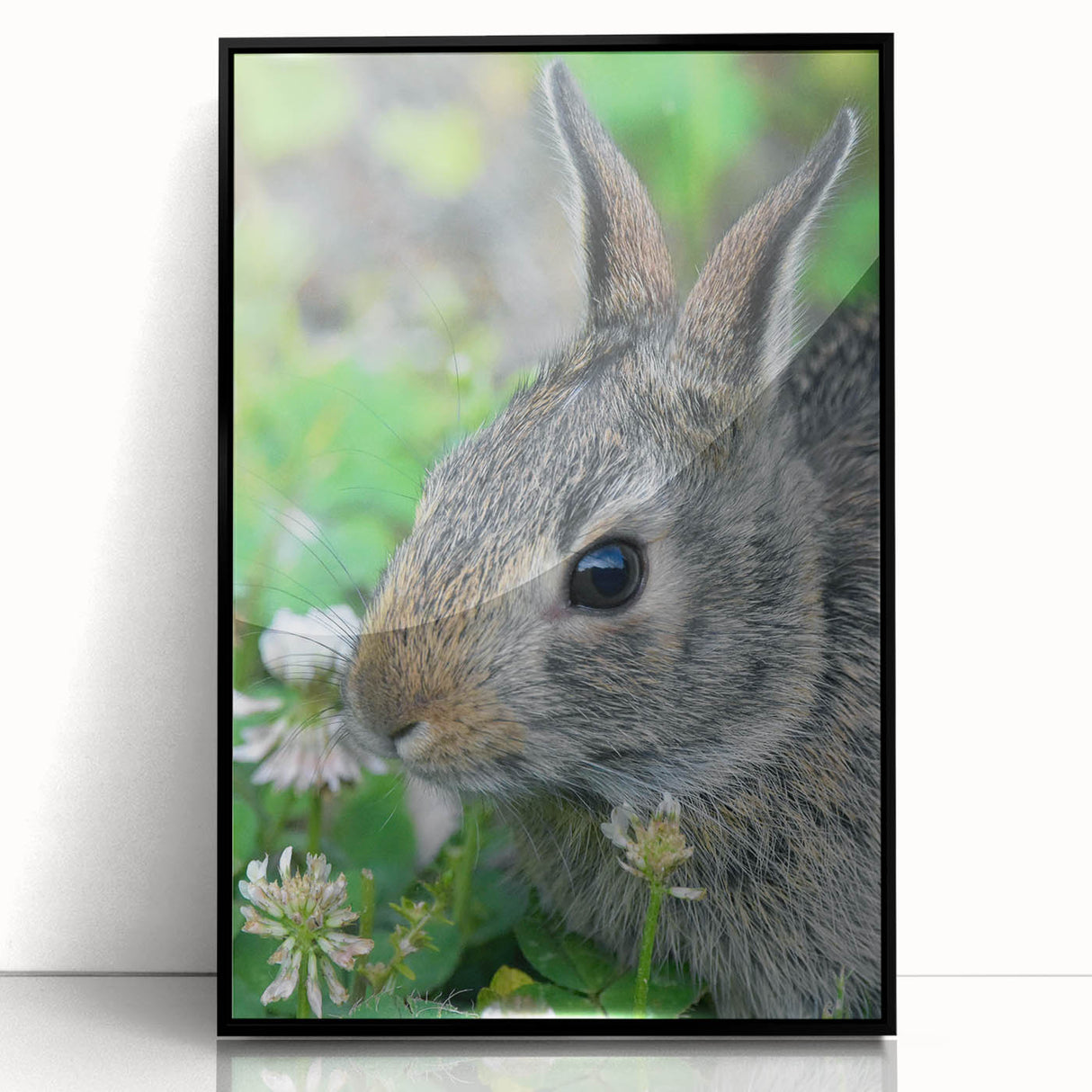 Large abstract wall art in vibrant spring hues on acrylic, framed in black, ideal for modern living room decor.