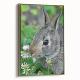 Framed canvas featuring a vintage-style landscape painting of spring, with soft green and gold tones.