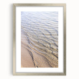 Textured abstract art print featuring dynamic swirls in warm summer hues on a silver-framed canvas, ideal for bedroom decor.