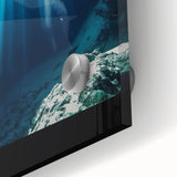 Close-up of an acrylic glass artwork depicting vibrant landscapes and caves, showcasing intricate designs and rich colors, perfect for modern home decor.