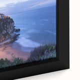Close-up of a framed canvas artwork depicting a stunning landscape with dramatic cliffs, vibrant colors, and intricate details, perfect for home decor accents.