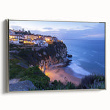 Framed canvas artwork depicting a stunning landscape with dramatic cliffs and serene ocean views, accented with a sleek silver frame, ideal for modern decor.