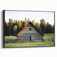 Black-framed canvas art featuring a landscape design of a serene barn scene, showcasing rich colors and textures, ideal for rustic home decor.