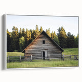 Framed landscape canvas featuring a serene barn scene in soft earth tones, displayed in a stylish white frame, ideal for rustic home decor and artistic ambiance.