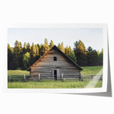 Landscape barn scene rolled print showcasing a rustic red barn amidst green fields and a vibrant blue sky, elegantly packaged in a protective cardboard tube. Perfect for country-themed decor.
