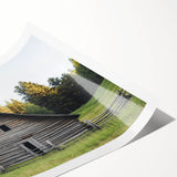 Rolled landscape barn print showcasing a rustic farm scene with vibrant colors, expertly packaged in a protective cardboard tube for safe delivery.