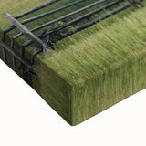 Close-up of a stretched canvas depicting a vibrant landscape featuring a rustic barn, rich green fields, and a serene blue sky, showcasing detailed textures and colors ideal for home decor.