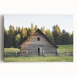 Stretched canvas showcasing a landscape painting of a rustic barn surrounded by lush green fields, ideal for farmhouse decor and country-themed interiors.