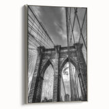 Framed canvas artwork showcasing a stunning landscape of a bridge, accented with a sleek silver frame, perfect for enhancing modern home decor. The piece captures intricate details of the scenery, offering an elegant touch to any living space.