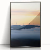Framed acrylic artwork showcasing a serene countryside landscape with vibrant green fields and a clear blue sky, elegantly presented with a sleek silver frame.