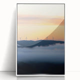 Framed acrylic artwork showcasing a serene countryside landscape with vibrant green fields and a clear blue sky, elegantly displayed in a white frame.