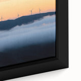 Close-up view of a framed canvas showcasing a serene countryside landscape, featuring lush green fields and a bright blue sky, perfect for home decor.