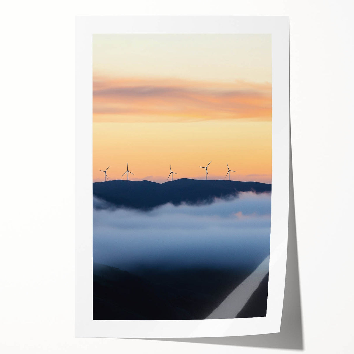 Rolled print showcasing a serene countryside landscape with rolling hills and a vibrant sunset, packaged securely in a protective cardboard tube for easy transport and display.