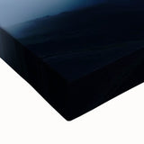 Close-up of a stretched canvas depicting serene countryside landscapes, featuring vibrant greens and soft blues, ideal for home decor or art collectors.