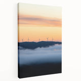 Stretched canvas artwork depicting a serene countryside landscape with rolling hills, vibrant greenery, and a blue sky, ideal for home décor.