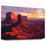 Desert landscape acrylic wall art showcasing vibrant orange and red hues, displayed in a sleek glass frame, ideal for modern home decor.