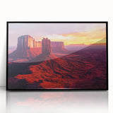 Framed acrylic artwork showcasing a vibrant desert landscape with hues of orange and blue, elegantly displayed with a sleek black frame, perfect for modern decor.