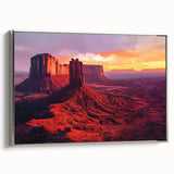 Framed canvas depicting a serene desert landscape with warm tones of orange and gold, highlighted by a sleek silver frame, perfect for modern home decor.