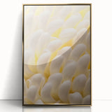 Close-up floral print in gold frame, featuring soft pink blossoms on a muted background, ideal for nursery wall art.