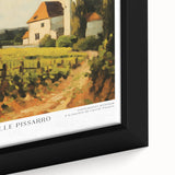 Close-up of a textured black wall art featuring colorful, abstract impressions on a framed canvas.