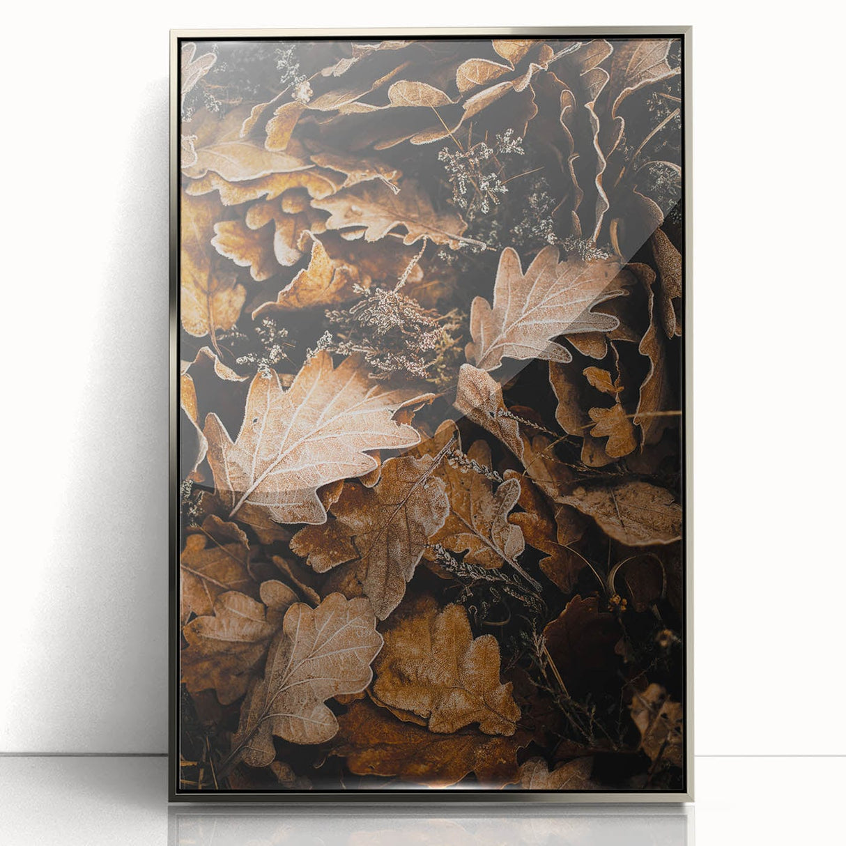 Mid-century modernist art depicting an autumnal scene in muted orange and brown tones, framed in silver acrylic.