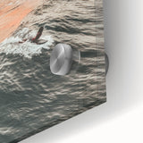 Large abstract wall art in vibrant orange and blue tones on acrylic glass.