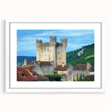 Framed landscape artwork featuring a castle, displayed in a white mat and frame, emphasizing intricate details and vibrant colors, perfect for home decor.