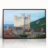 Framed acrylic artwork showcasing a stunning landscape with a majestic castle, set against a vibrant sunset, featuring a sleek black frame for an elegant display.