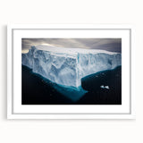 Framed landscape artwork depicting majestic cliffs, presented with a white mat for an elegant finish, perfect for enhancing home decor.