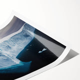 Vibrant landscape print showcasing dramatic cliffs and blue skies, rolled and ready for display, emphasizing natural beauty and artistic detail. Perfect for home decor.