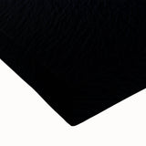 Close-up of a stretched canvas depicting a stunning landscape of rugged cliffs, showcasing vibrant colors and intricate textures, perfect for home decor.