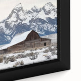 Close-up of a framed landscape canvas art depicting a serene barn scene, showcasing vibrant colors and detailed textures, perfect for rustic home decor.