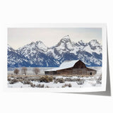 Rolled canvas print showcasing a vibrant landscape scene of a rustic barn surrounded by lush greenery, expertly packaged in a protective cardboard tube for safe delivery.