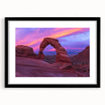 Framed landscape artwork showcasing a breathtaking canyon scene with vibrant colors, featuring a black mat border for an elegant presentation. Perfect for enhancing home decor.