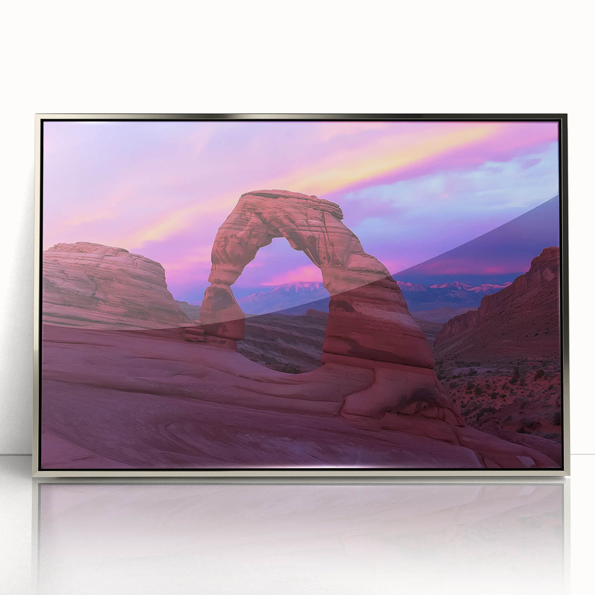 Framed acrylic artwork showcasing a stunning landscape of canyons in rich earth tones, highlighted by a sleek silver frame, perfect for modern home decor.